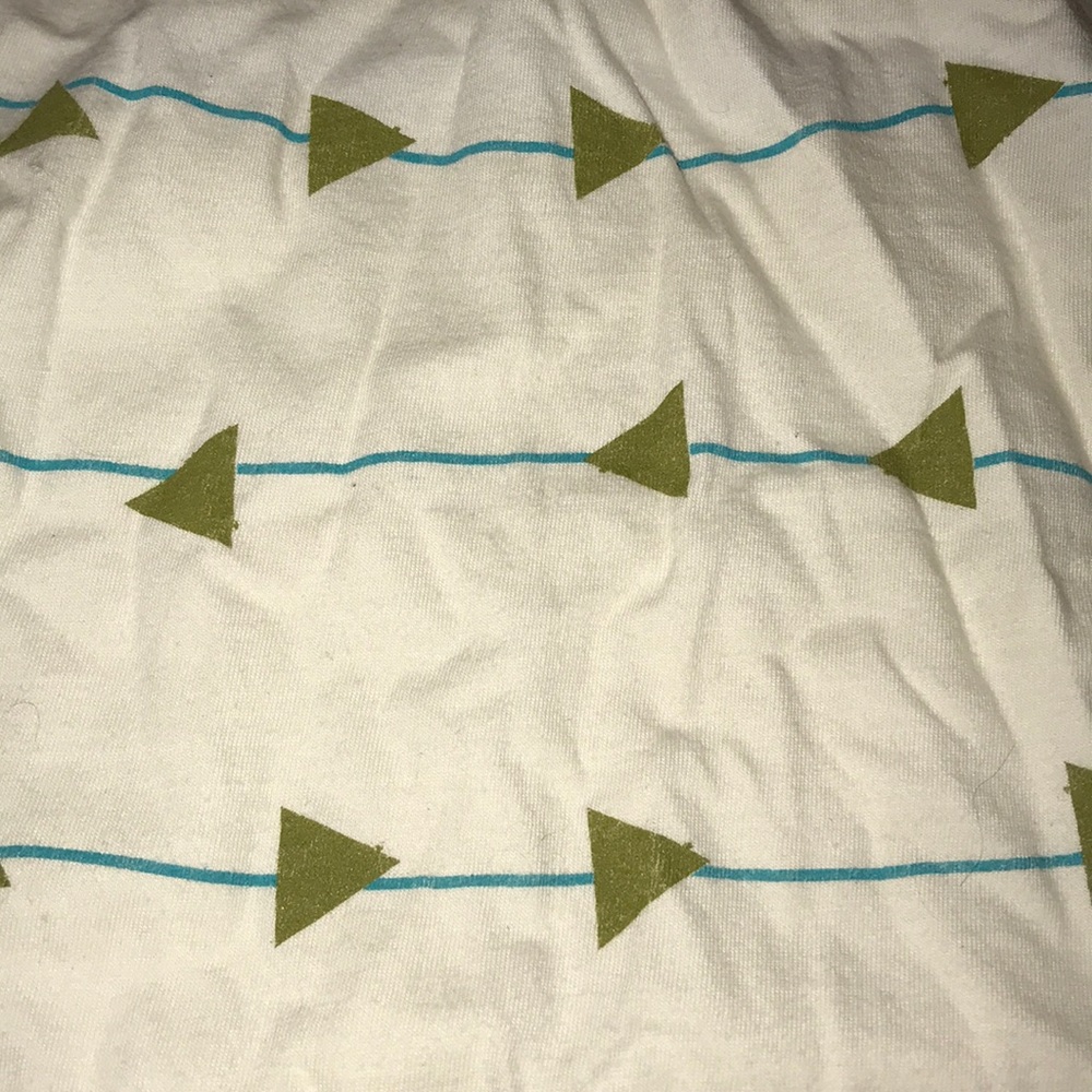 Men’s cream colored tee with metallic triangles